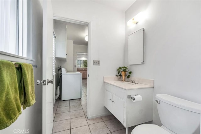 10020 Wystone Ave, Northridge, CA 91324 - bathroom with separate washer and dryer, vanity, and tile patterned flooring