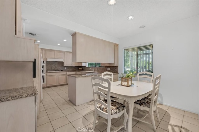 10020 Wystone Ave, Northridge, CA 91324 - dining space with light tile patterned floors, recessed lighting, and a textured ceiling
