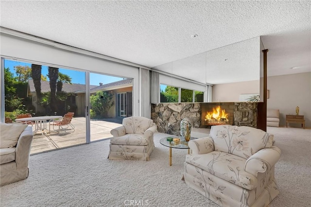 10020 Wystone Ave, Northridge, CA 91324 - carpeted living area with a textured ceiling and a stone fireplace