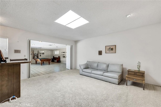 10020 Wystone Ave, Northridge, CA 91324 - tiled living area featuring billiards, carpet, plenty of natural light, and a textured ceiling