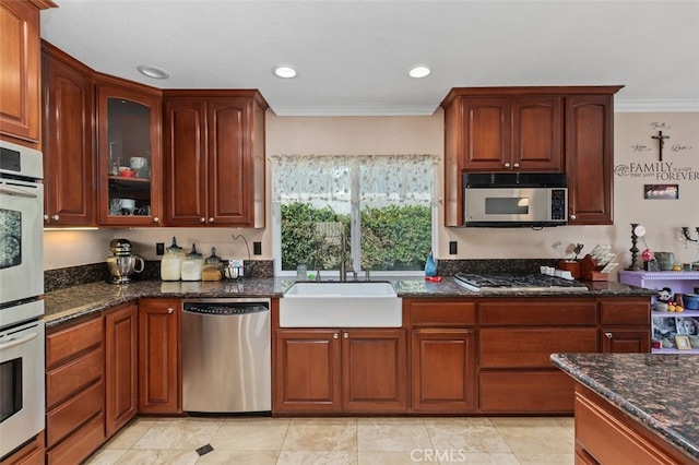 24682 Via Tequila, Lake Forest, CA 92630 - kitchen with stainless steel appliances, crown molding, dark stone countertops, glass insert cabinets, and recessed lighting