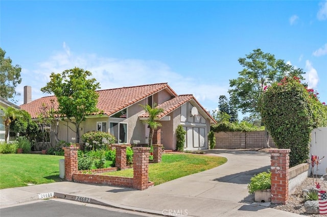 24682 Via Tequila, Lake Forest, CA 92630 - view of front of home with concrete driveway, stucco siding, and a tiled roof