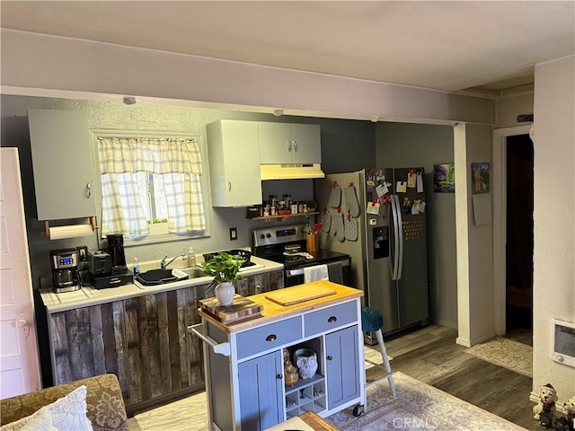 16238 35th Ave, Clearlake, CA 95422 - kitchen with appliances with stainless steel finishes, under cabinet range hood, light wood finished floors, open shelves, and blue cabinetry