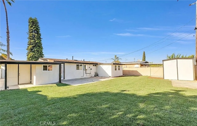 11912 Arthur Dr, Anaheim, CA 92804 - back of property featuring a shed, a fenced backyard, a patio, and stucco siding