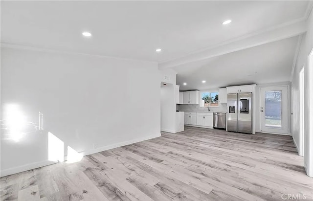 11912 Arthur Dr, Anaheim, CA 92804 - unfurnished living room featuring light wood-style flooring and recessed lighting
