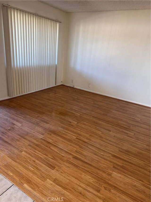 2501 W Redondo Beach Blvd Unit 317, Gardena, CA 90249 - unfurnished room featuring wood finished floors and a textured ceiling