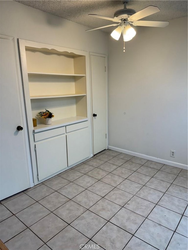 2501 W Redondo Beach Blvd Unit 317, Gardena, CA 90249 - empty room featuring a textured ceiling, a ceiling fan, and light tile patterned floors