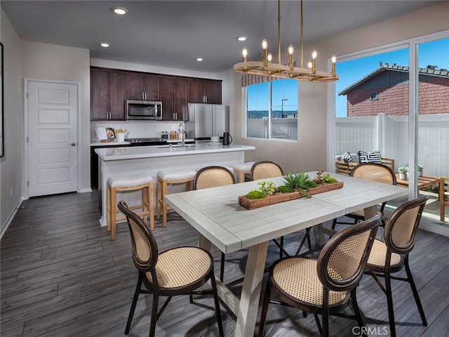 2141 Bergamot St, Redlands, CA 92374 - dining room featuring dark wood-type flooring, recessed lighting, and a chandelier