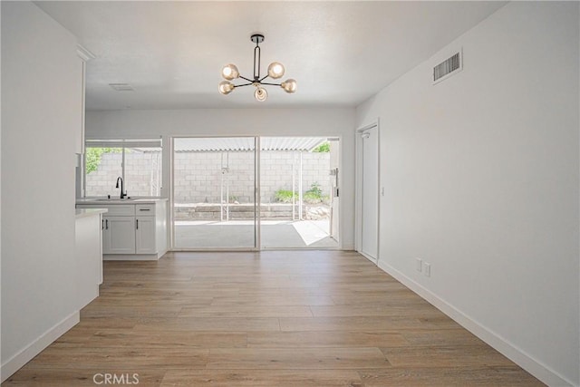 20157 Mckay Dr, Walnut, CA 91789 - unfurnished room with a chandelier, healthy amount of natural light, and light wood-type flooring