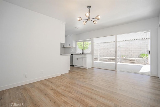 20157 Mckay Dr, Walnut, CA 91789 - unfurnished living room with a chandelier and light wood finished floors