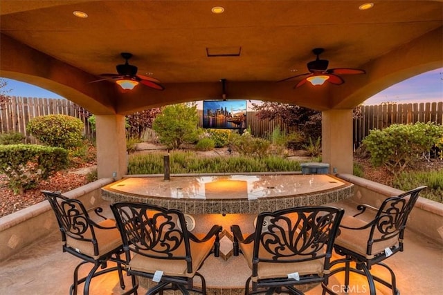 22515 Santa Clarita Corte, Perris, CA 92570 - patio terrace at dusk featuring a ceiling fan and a patio area
