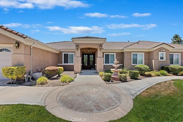 22515 Santa Clarita Corte, Perris, CA 92570 - rear view of house featuring french doors, stucco siding, and a tiled roof