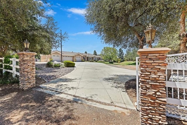 22515 Santa Clarita Corte, Perris, CA 92570 - view of concrete driveway with street lights and a residential view