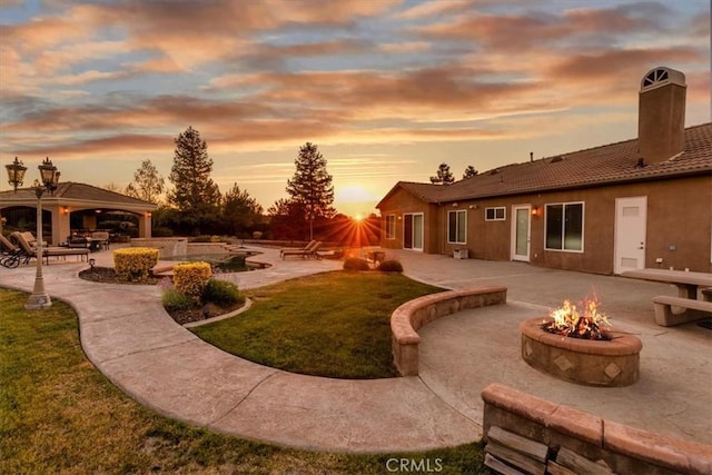 22515 Santa Clarita Corte, Perris, CA 92570 - view of green lawn with a fire pit, a gazebo, and a patio