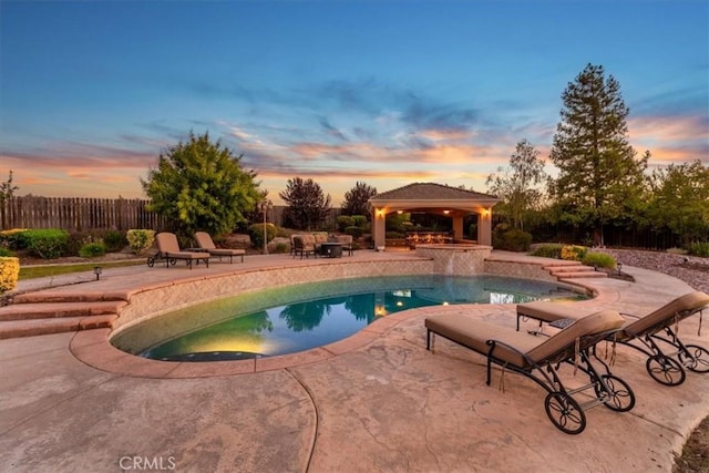 22515 Santa Clarita Corte, Perris, CA 92570 - pool at dusk featuring a gazebo and a patio area