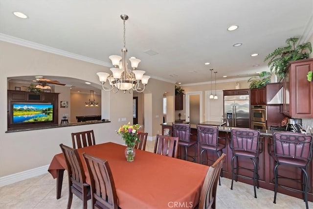 22515 Santa Clarita Corte, Perris, CA 92570 - dining area featuring arched walkways, a chandelier, recessed lighting, ornamental molding, and light tile patterned flooring