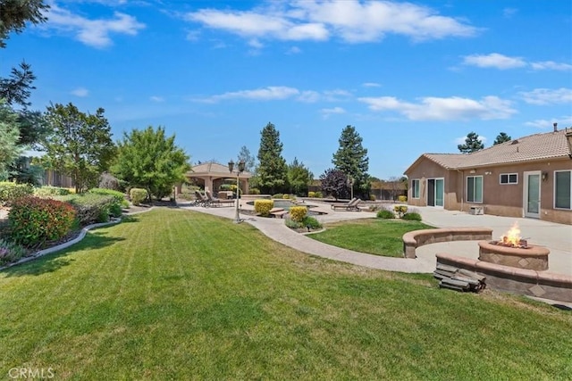 22515 Santa Clarita Corte, Perris, CA 92570 - view of grassy yard with a gazebo, a fire pit, and a patio