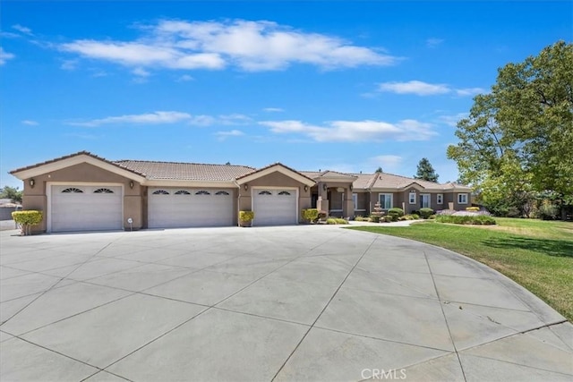 22515 Santa Clarita Corte, Perris, CA 92570 - ranch-style home with an attached garage, driveway, a front lawn, stucco siding, and a tiled roof