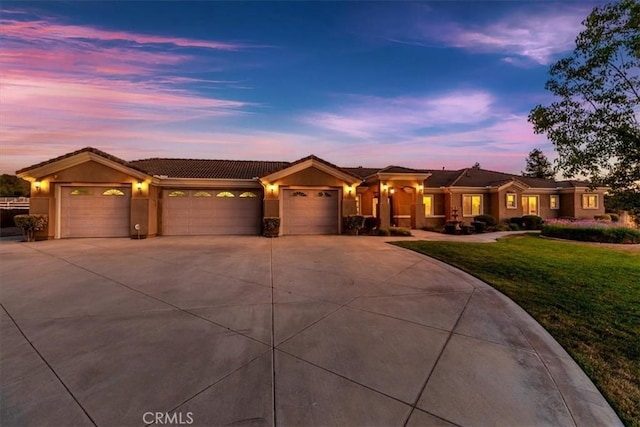 22515 Santa Clarita Corte, Perris, CA 92570 - view of front of property with a garage, concrete driveway, a front lawn, and stucco siding