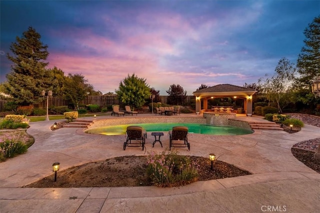 22515 Santa Clarita Corte, Perris, CA 92570 - pool at dusk featuring a gazebo, an outdoor pool, and a patio