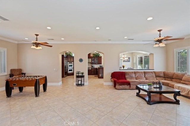 22515 Santa Clarita Corte, Perris, CA 92570 - living room with a ceiling fan, arched walkways, recessed lighting, light tile patterned floors, and crown molding