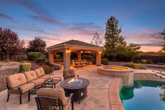 22515 Santa Clarita Corte, Perris, CA 92570 - pool at dusk with a gazebo, a patio area, an in-ground hot tub, and an outdoor living space with a fire pit