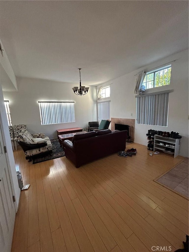 621 Hazel Ave, Rosemead, CA 91770 - living area featuring a fireplace, a chandelier, and hardwood / wood-style flooring