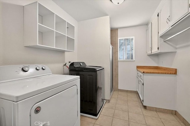 5566 Darrah Rd, Mariposa, CA 95338 - laundry area with independent washer and dryer, cabinet space, and light tile patterned floors
