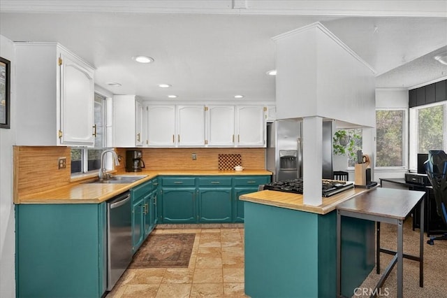 5566 Darrah Rd, Mariposa, CA 95338 - kitchen featuring white cabinetry, stainless steel appliances, backsplash, butcher block countertops, and recessed lighting