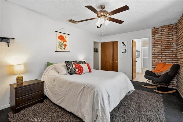 5566 Darrah Rd, Mariposa, CA 95338 - bedroom with carpet floors, a textured ceiling, ensuite bathroom, and ceiling fan