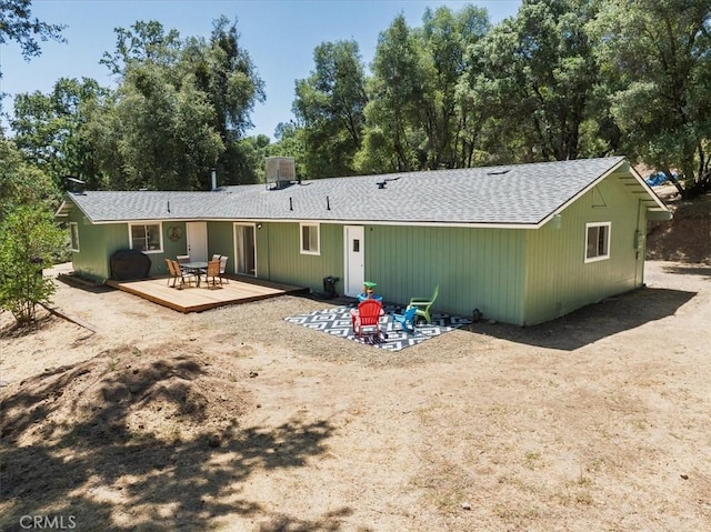 5566 Darrah Rd, Mariposa, CA 95338 - rear view of house with a deck, a shingled roof, and view of scattered trees
