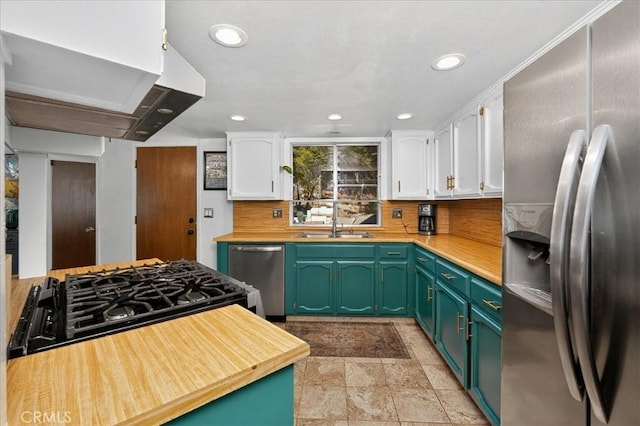 5566 Darrah Rd, Mariposa, CA 95338 - kitchen featuring appliances with stainless steel finishes, white cabinets, green cabinetry, recessed lighting, and backsplash