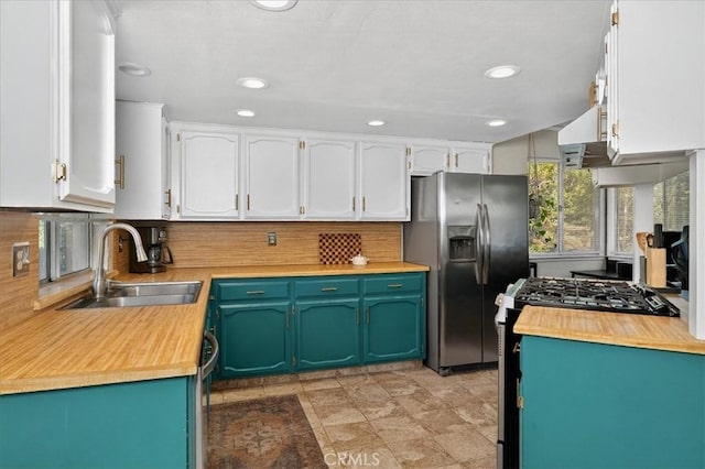 5566 Darrah Rd, Mariposa, CA 95338 - kitchen featuring stainless steel fridge, wood counters, white cabinets, decorative backsplash, and recessed lighting