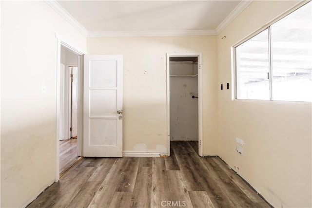 4576 166th St, Lawndale, CA 90260 - unfurnished bedroom with crown molding, wood finished floors, and a spacious closet