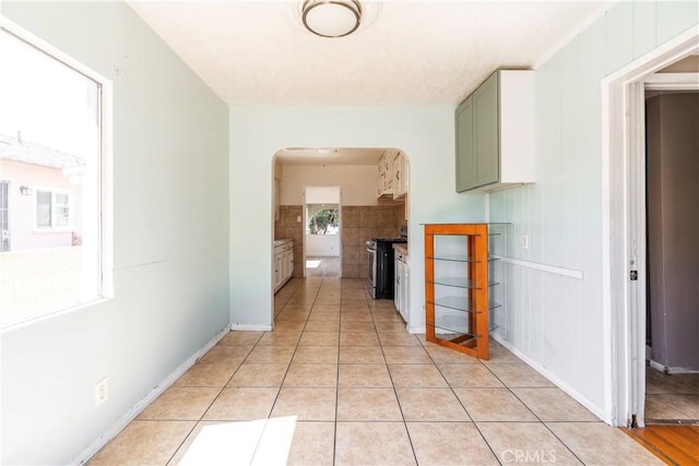 4576 166th St, Lawndale, CA 90260 - hallway featuring arched walkways and light tile patterned floors