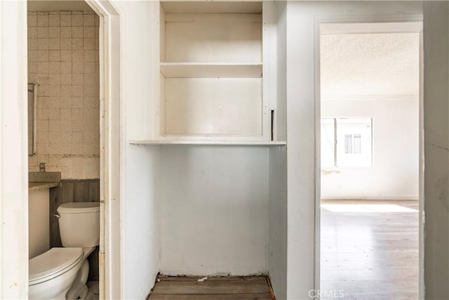 4576 166th St, Lawndale, CA 90260 - bathroom featuring toilet and wood finished floors