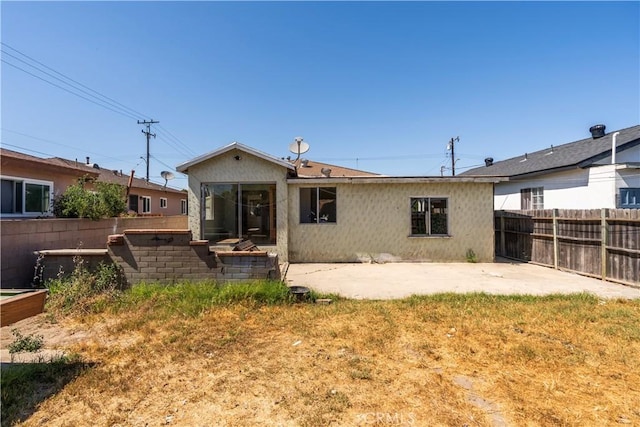 4576 166th St, Lawndale, CA 90260 - rear view of house with a patio and a fenced backyard