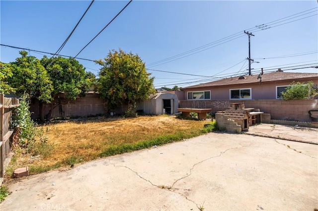 4576 166th St, Lawndale, CA 90260 - fenced backyard with a patio and a shed