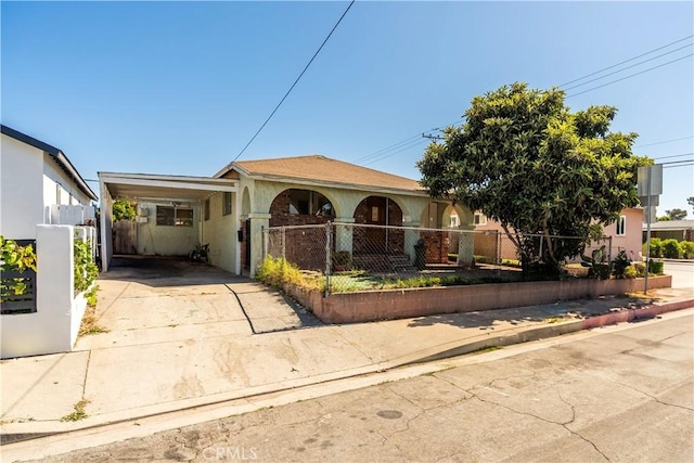 4576 166th St, Lawndale, CA 90260 - view of front facade with a fenced front yard, a carport, driveway, and stucco siding