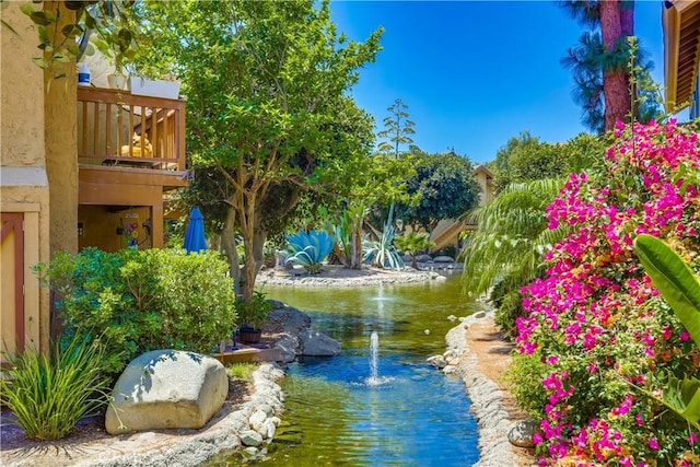 321 Orange Blossom Unit 166, Irvine, CA 92618 - surrounding community with a garden pond