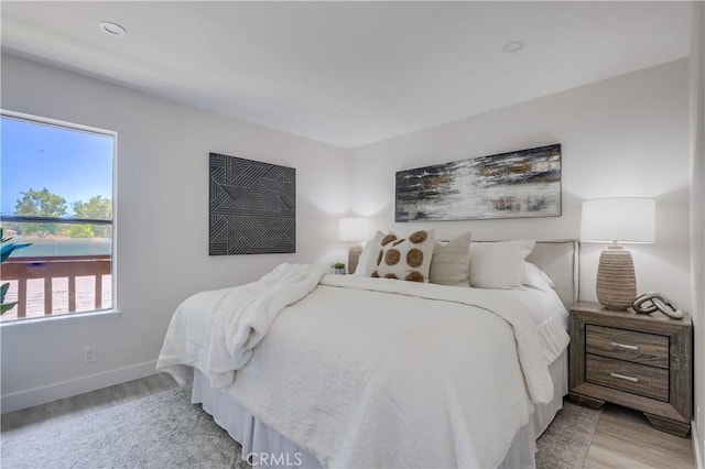 321 Orange Blossom Unit 166, Irvine, CA 92618 - bedroom featuring light wood-type flooring and baseboards