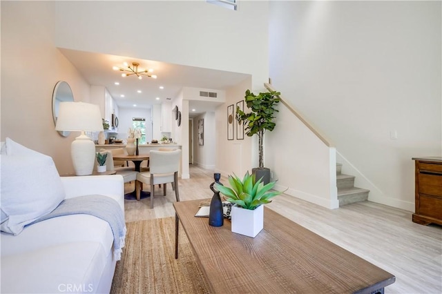 321 Orange Blossom Unit 166, Irvine, CA 92618 - living area with stairs, a chandelier, light wood-type flooring, and recessed lighting