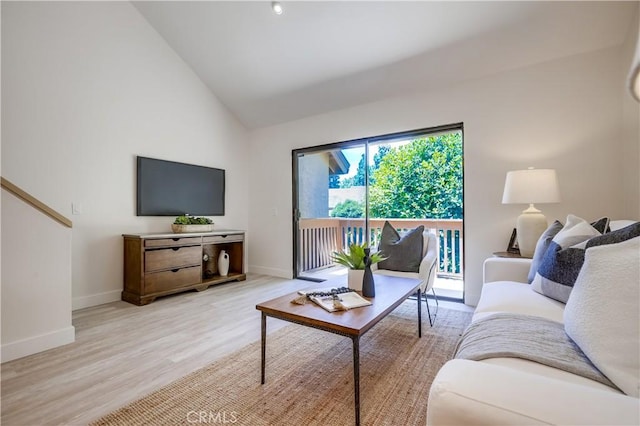 321 Orange Blossom Unit 166, Irvine, CA 92618 - living room featuring light wood-style flooring and high vaulted ceiling