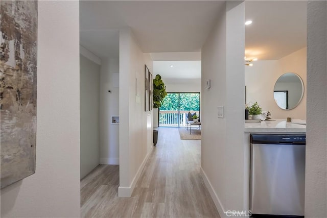 321 Orange Blossom Unit 166, Irvine, CA 92618 - hallway with light wood-type flooring and baseboards