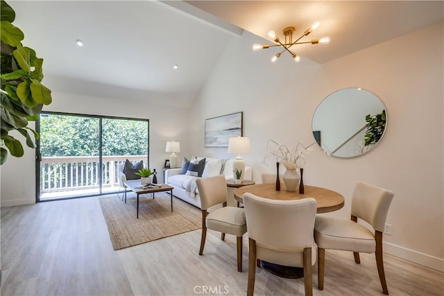 321 Orange Blossom Unit 166, Irvine, CA 92618 - living room with a chandelier, wood finished floors, and high vaulted ceiling