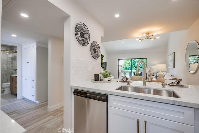 321 Orange Blossom Unit 166, Irvine, CA 92618 - kitchen featuring dishwasher, light stone counters, open floor plan, light wood finished floors, and recessed lighting