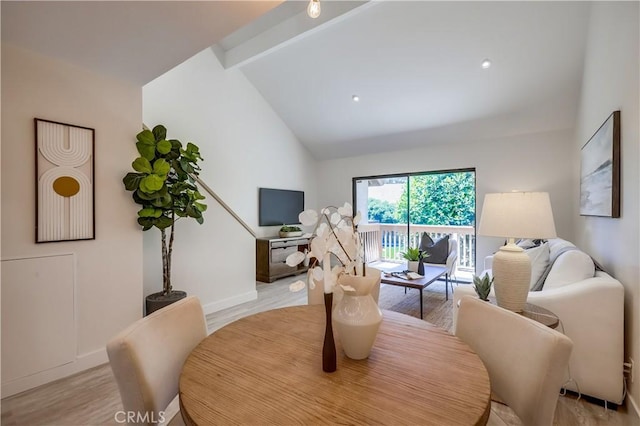 321 Orange Blossom Unit 166, Irvine, CA 92618 - living room featuring light wood-style flooring, beam ceiling, and high vaulted ceiling