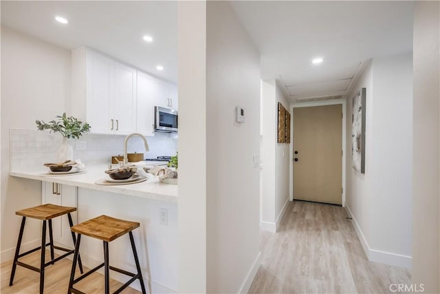 321 Orange Blossom Unit 166, Irvine, CA 92618 - hall with light wood-type flooring and recessed lighting