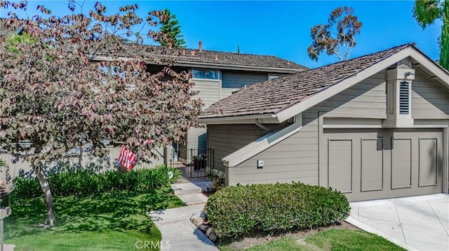 14 Bridgewood Unit 22, Irvine, CA 92604 - view of front of home with driveway and a garage