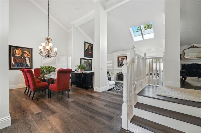 14 Bridgewood Unit 22, Irvine, CA 92604 - dining room featuring high vaulted ceiling, a skylight, a chandelier, wood finished floors, and stairway